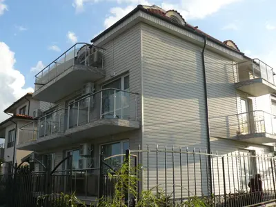 a building with balconies on the side of it at Morska Zvezda Guest House in Chernomorets