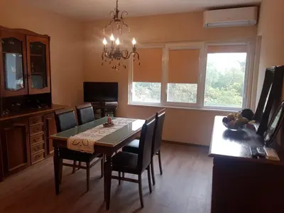 a dining room with a table and chairs at Odessus in Varna City