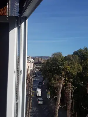 a view from a window of a street with cars at Odessus in Varna City