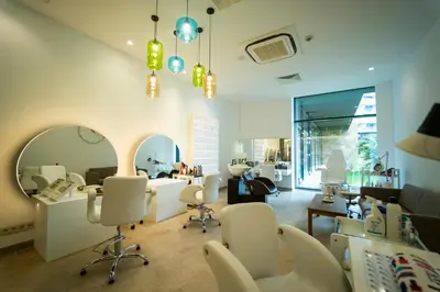 a hair salon with white chairs and a mirror at Wave Resort - Ultra All Inclusive in Pomorie