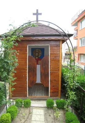a small wooden chapel with a painting of a cross at Aparthotel Anixi in Obzor