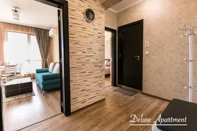 a room with a door leading to a living room at Apartment Cathedral Deluxe in Varna City