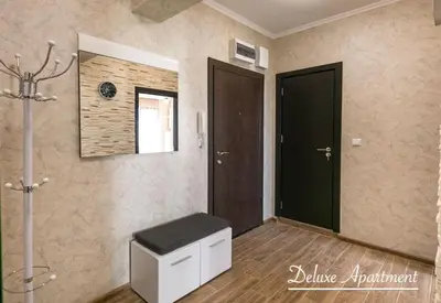 a room with a black door and a stool at Apartment Cathedral Deluxe in Varna City