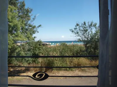 a view of a beach from a window at Dion Apartments in Lozenets