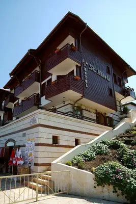 a building with balconies on the side of it at Family Hotel Saint Nikola in Nesebar