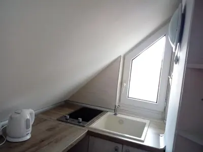 a small kitchen with a sink and a window at Studio Lilou in Varna City