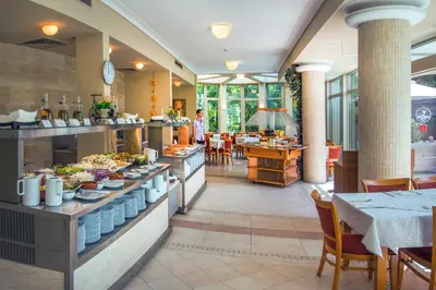 a restaurant with a buffet line with food on display at Jeravi Beach Hotel - All Inclusive in Sunny Beach
