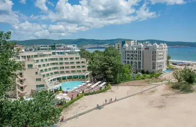 a resort with a beach and a pool and buildings at Jeravi Beach Hotel - All Inclusive in Sunny Beach