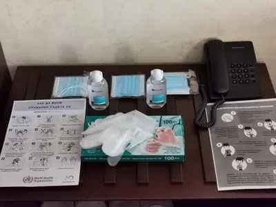 a table with a phone and a birth kit at ROYAL BEACH HOTEL apartment in Sunny Beach