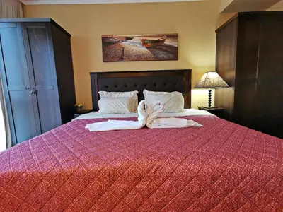 a towel laying on a bed in a hotel room at ROYAL BEACH HOTEL apartment in Sunny Beach