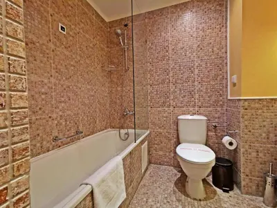 a bathroom with a toilet and a tub and a sink at ROYAL BEACH HOTEL apartment in Sunny Beach