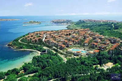 an aerial view of a resort on a island in the water at Gardenia Suites in Sozopol