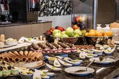 a buffet with many different types of food on a table at Prestige Fort Beach - Full Board in Sveti Vlas