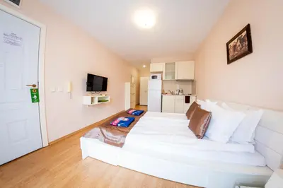 a bedroom with a large white bed in a room at Prestige Fort Beach - Full Board in Sveti Vlas
