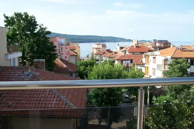 a view of a city from a balcony at Guest House Donchevi in Primorsko