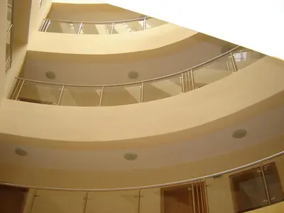 a spiral staircase in a building with glass ceilings at Apart Hotel Vechna R in Sunny Beach