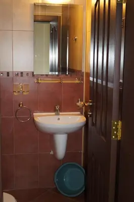 a bathroom with a sink and a mirror at Апартхотел Созополски перли in Sozopol