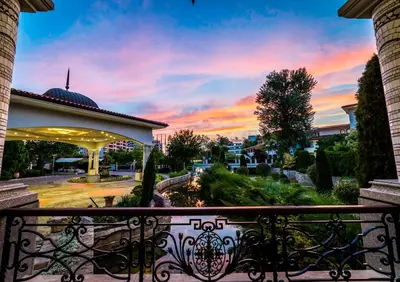 a sunset view from a balcony of a building at Helena Park - Ultra All Inclusive in Sunny Beach