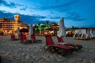 a group of chairs and umbrellas on the beach at Helena Sands in Sunny Beach