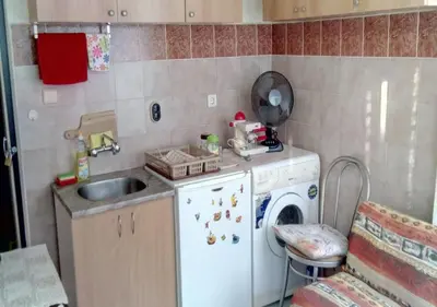 a small kitchen with a sink and a washing machine at Апартамент Флора - гр.Приморско ММЦ in Primorsko