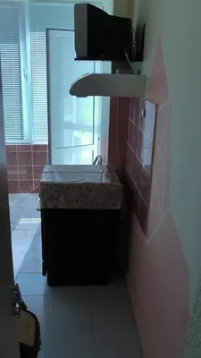 a bathroom with a sink and a window at Апартамент Флора - гр.Приморско ММЦ in Primorsko