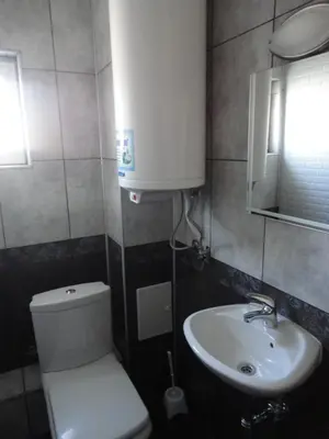 a small bathroom with a toilet and a sink at Casa Luba Sunny beach in Sunny Beach