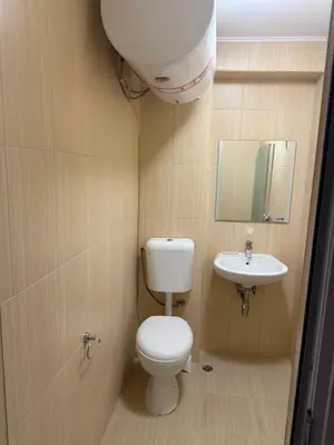 a small bathroom with a toilet and a sink at Casa Luba Sunny beach in Sunny Beach