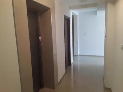 an empty hallway with two doors and a corridorngth at CHATEAU DEL MAR C31a Studio Sunny Beach in Sunny Beach