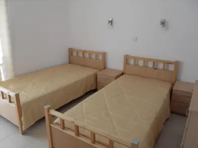 two beds sitting next to each other in a room at HillTop Villa in Burgas City