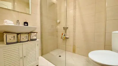 a bathroom with a shower and a sink and a toilet at APARTELLO Modern Apartment - Balkan Breeze 7 in Sunny Beach
