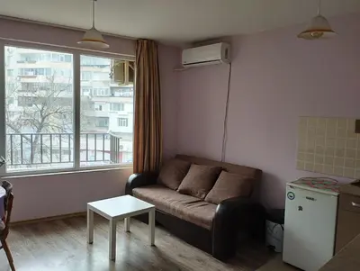 a living room with a couch and a window at CITY STAY in Varna 2 in Varna City