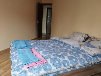 a bed with two towels on top of it at CITY STAY in Varna 2 in Varna City