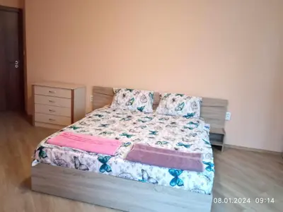 a bedroom with a bed and a dresser at CITY STAY in Varna 2 in Varna City