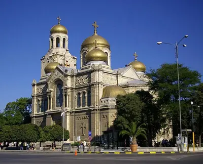 a large cathedral with gold domes and a cross on top at CITY STAY in Varna 2 in Varna City