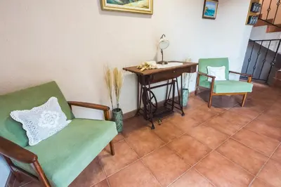 a room with two chairs and a table with a desk at Hotel Albatros Old Town in Sozopol