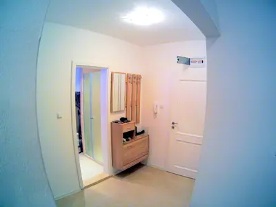 a hallway with a door leading to a room at Aivazovsky Park Anchialos H14 in Pomorie