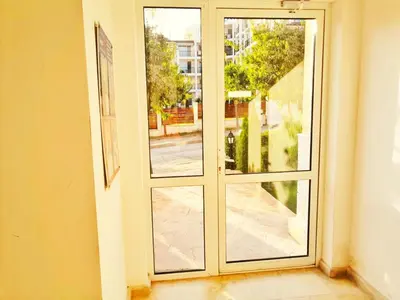 an empty room with a sliding glass door at Byala Apartments BSR 7 in Byala