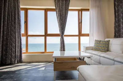 a living room with a view of the ocean at Penthouse at White Cliffs in Byala