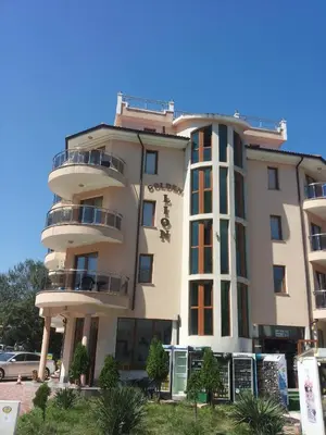 a large building with balconies on the side of it at Family Hotel Golden Lion in Primorsko