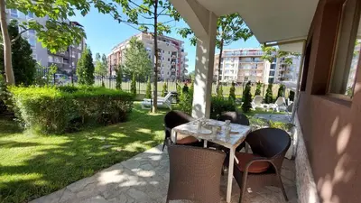 a patio with a table and chairs on a patio at Diamond Palace in Sunny Beach