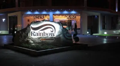 a sign for a restaurant in front of a building at Rainbow 3 Apartment-studio 223 in Sunny Beach