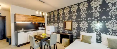 a kitchen and a dining room with a table in a room at Briz Beach Apartments in Sunny Beach
