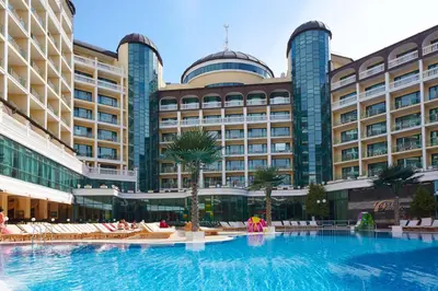 a large hotel with a large swimming pool in front of it at Planeta Hotel & Aquapark FREE Beach Access - ULTRA All Inclusive in Sunny Beach