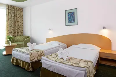 two beds in a hotel room with two rabbits on them at Mena Palace Hotel - All Inclusive in Sunny Beach
