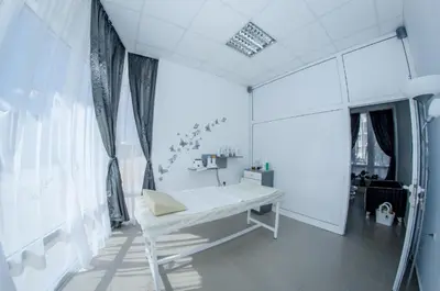 a white bathroom with a tub and a shower at Holiday and Orchid Fort Noks Apartments in Sunny Beach
