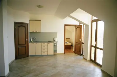 a kitchen with an archway in the middle of a room at Villa Via Pontica in Sozopol
