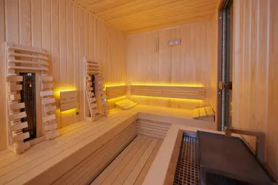 a sauna with wood paneling and a wooden floor at Hotel Saint John Baptist Nessebar in Nesebar