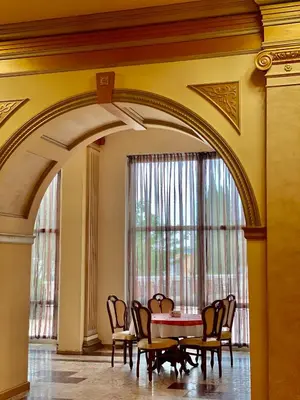 an archway in a room with a table and chairs at Duni Marina Beach Hotel - All Inclusive in Sozopol