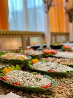 a bunch of pizzas sitting on a table at Duni Marina Royal Palace Hotel - Ultra All Inclusive in Sozopol