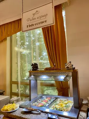 a buffet of food on a table with a sign at Duni Marina Royal Palace Hotel - Ultra All Inclusive in Sozopol